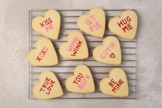 Valentines Day Concept: Flat lay Heart shaped sugar cookies on a cooling rack.