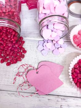 Valentine's Day candy hearts and heart shaped gift tags. 