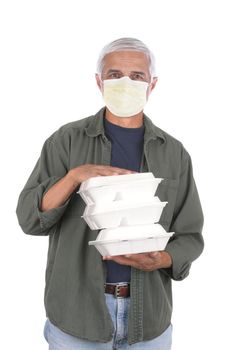 Food delivery man wearing covid-19 protective mask carrying three take-out food containers. Isolated on white.