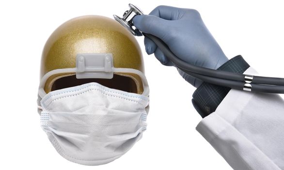 A Football Helmet with a surgical mask for Covid-19 protection and a doctors hand with stethoscope, on a white background.