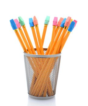 New pencils with erasers in a pencil cup over white with reflection.