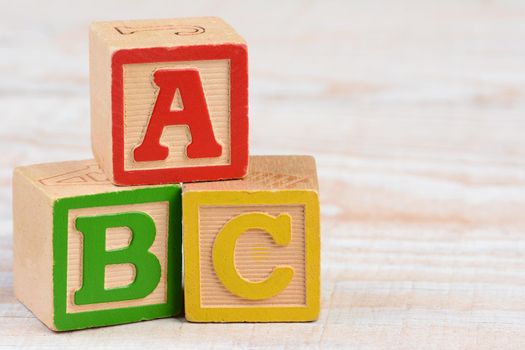 Three antique Childrens Alphabet Blocks stacked in ABC order