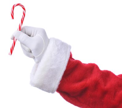 Closeup of Santa Claus holding a candy cane in his fingers isolated on white. Hand and sleeve only.