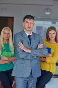 group portrait of teacher with students in shcool classrom