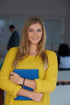 portrait of young female student at school classroom