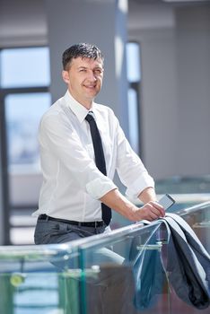 business man using phone at modern office space