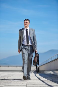 urban outdoor portrait of middle aged senior  business man