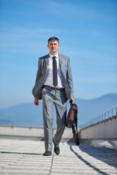 urban outdoor portrait of middle aged senior  business man