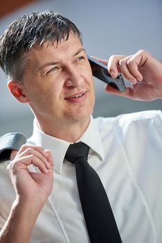 business man using phone at modern office space