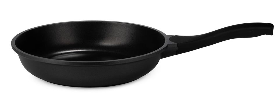 New black clean frying pan isolated on white background