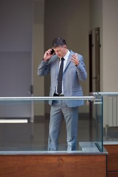 business man using phone at modern office space