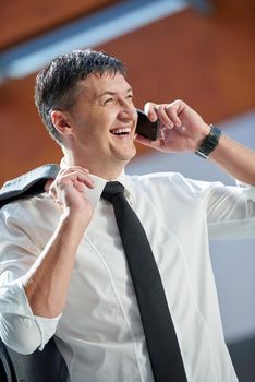 business man using phone at modern office space