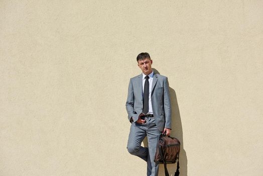 urban outdoor portrait of middle aged senior  business man