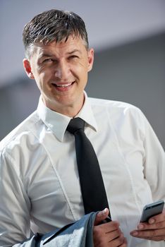 business man using phone at modern office space