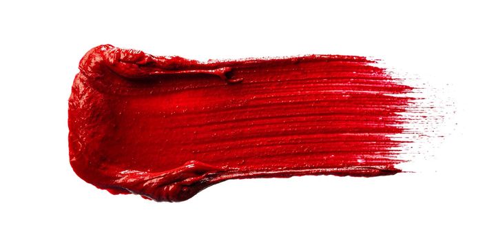 Stain swatch of a red matte lipstick isolated on white background