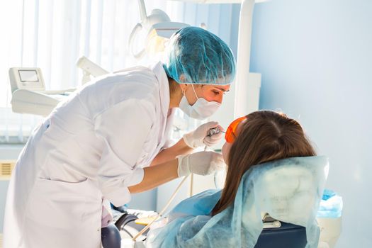Woman at the dentist's chair during a dental procedure.