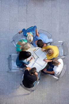 top view,  group of students together  at school table working homework and have fun