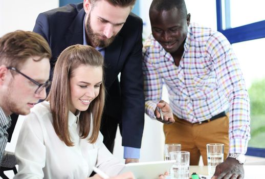 Image of business partners discussing documents and ideas at meeting