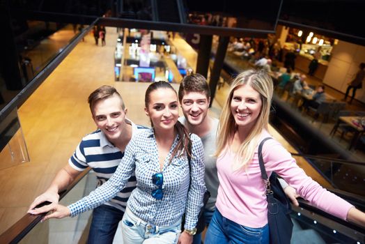 group of happy  friends in shopping mall have fun