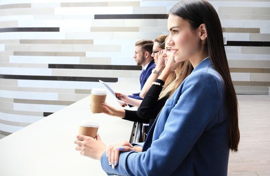 business team standing in a row outside the office