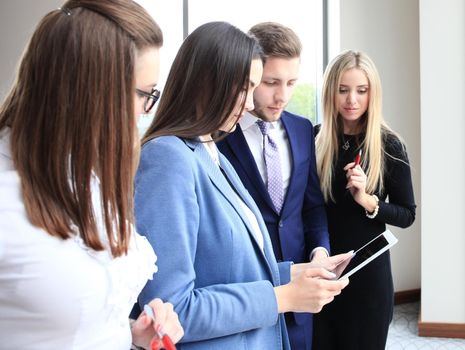 Group of buisness people working on tablet