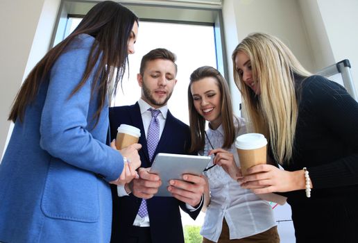 Group of buisness people working on tablet