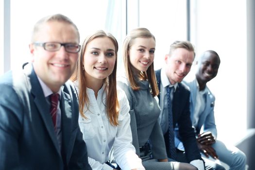 Portrait of a positive business employees at an office business meeting.