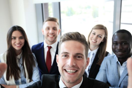 People taking selfie at business meeting