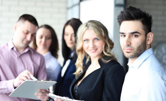 Team young professionals having casual discussion in office. Executives having friendly discussion during break.