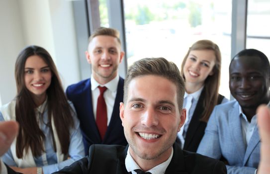 People taking selfie at business meeting