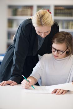 female teacher helping students on class about lessons and give support