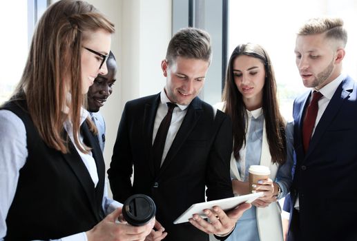 Group of buisness people working on tablet