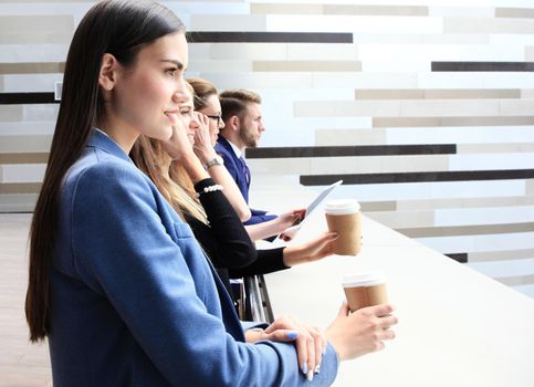 business team standing in a row outside the office