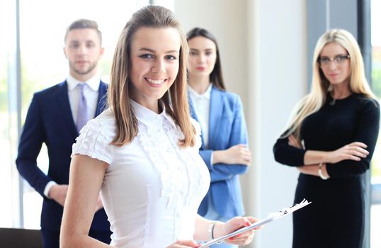 Face of beautiful woman on the background of business people