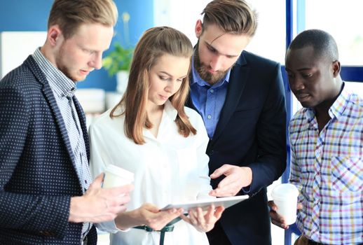 Group of buisness people working on tablet