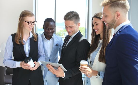 Group of buisness people working on tablet