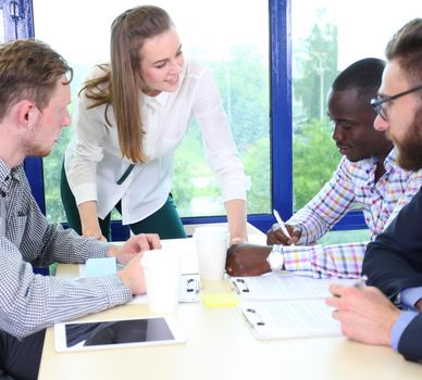 startup business team on meeting in modern bright office interior brainstorming, working on laptop and tablet computer