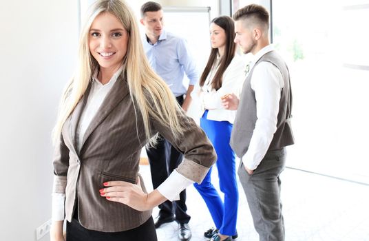 Face of beautiful woman on the background of business people