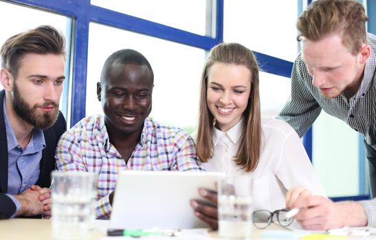 Image of business partners discussing documents and ideas at meeting