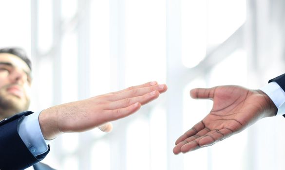 Business handshake. Business man giving a handshake to close the deal