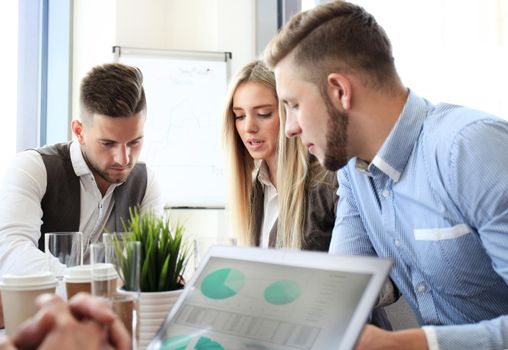 Portrait of smart business partners planning work at meeting