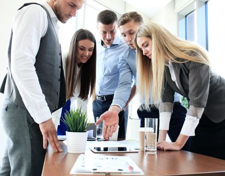 Group of buisness people working on tablet