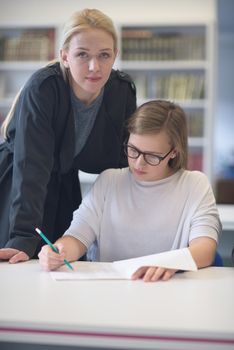 female teacher helping students on class about lessons and give support