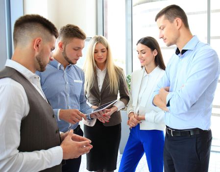 Group of buisness people working on tablet