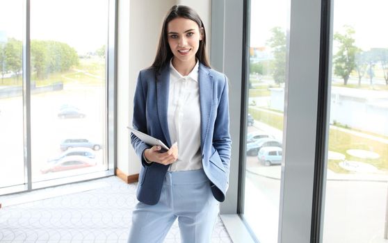 Modern business woman in the office with copy space