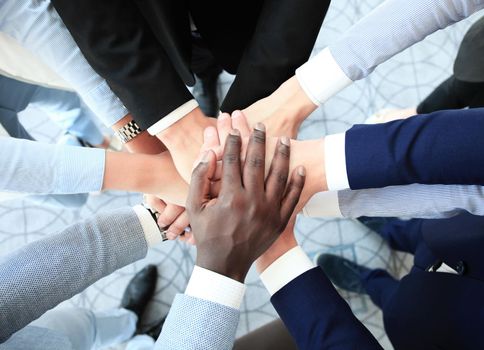 Group of business people joining hands