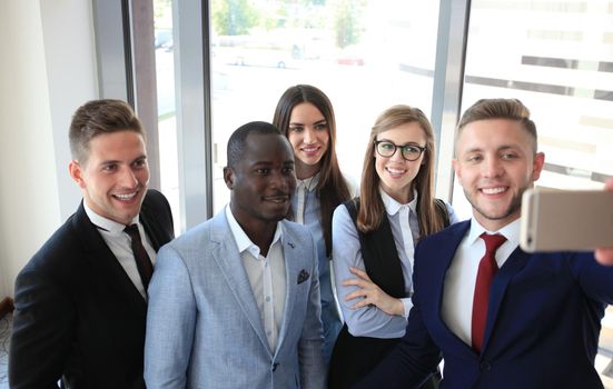 People taking selfie at business meeting