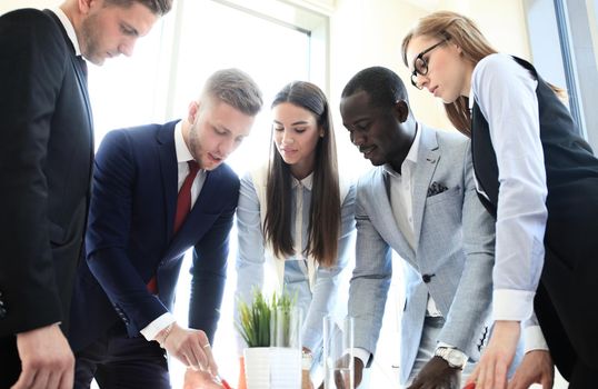 Business team discussing together business plans in office