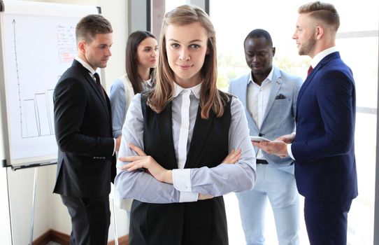 Face of beautiful woman on the background of business people