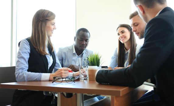 Portrait of smart business partners planning work at meeting